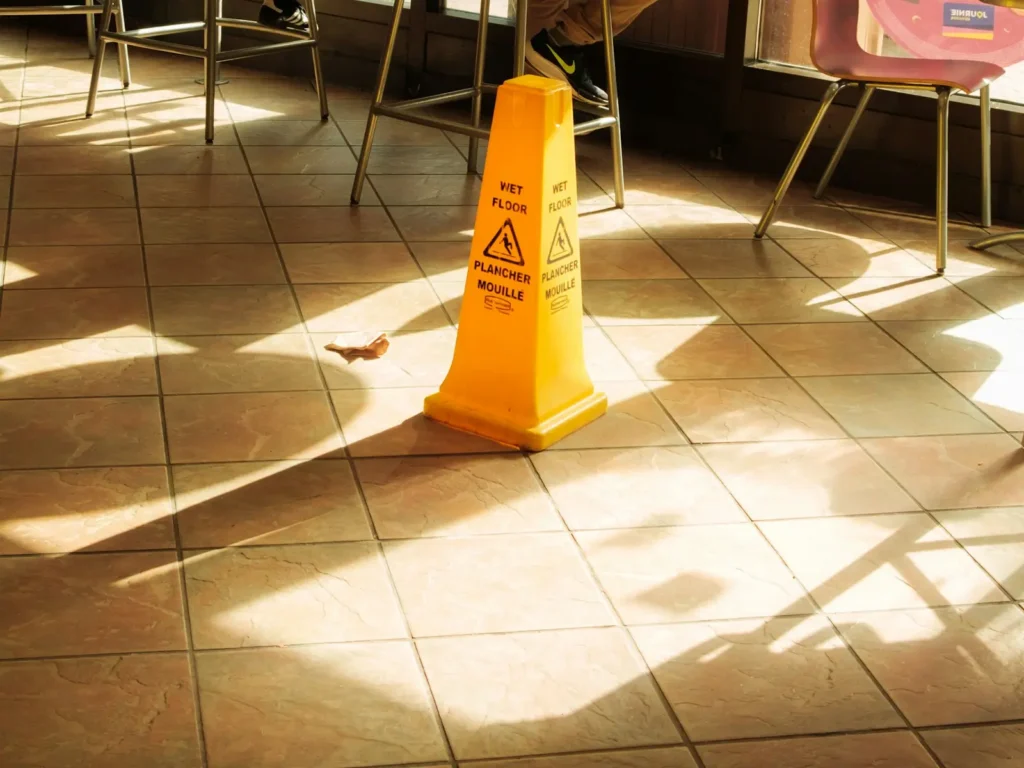 Wet floor caution sign on a tile floor