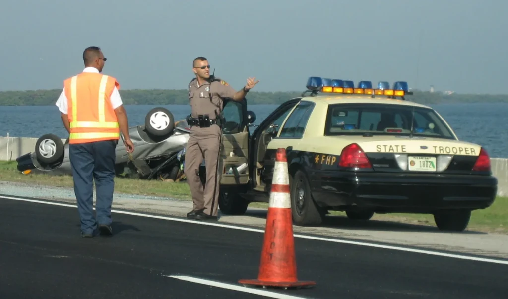 Florida crash report: a Florida Highway Patrol trooper at a crash scene