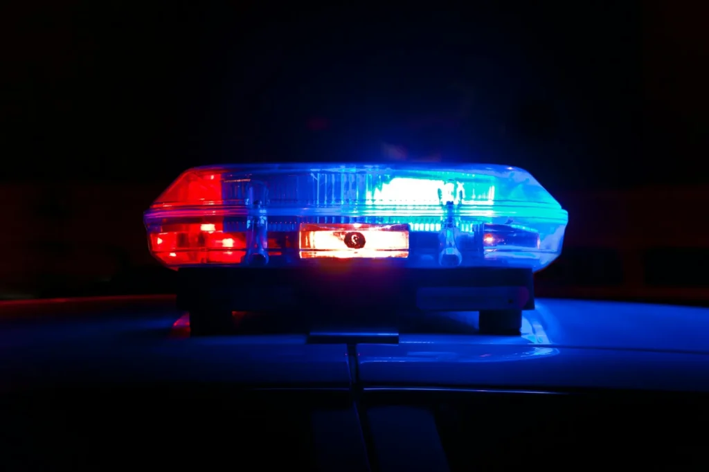How to report a car accident in Florida: one driver photographs the damage while the other calls police